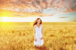 © chesterF - Beautiful young woman in wheat field