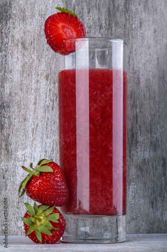 Fototapeta na wymiar Domestic healthy strawberry juice on rustic table