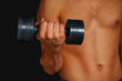 © Alex Photo - Strong man is lifting dumbbell