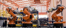 Robots Welding In A Production Line
