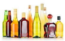 Bottles Of Assorted Alcoholic Beverages Isolated On White