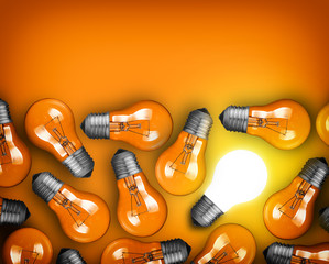 Idea concept with row of light bulbs and glowing bulb