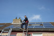 © Chris Willemsen  - man smiling and happy with solar panels