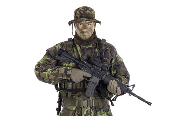 Soldier in camouflage and modern weapon M4.