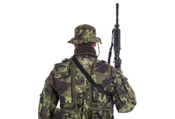 Soldier in camouflage and modern weapon M4.