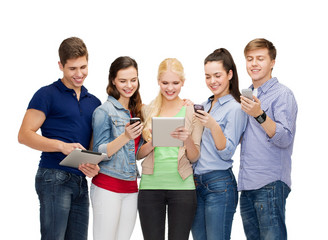 Wall Mural - smiling students using smartphones and tablet pc
