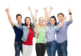Wall Mural - group of smiling students showing thumbs up