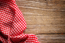 Checkered Tablecloth On Wooden Table