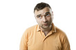 © Iryna&Maya - Confused man looks aside. White background
