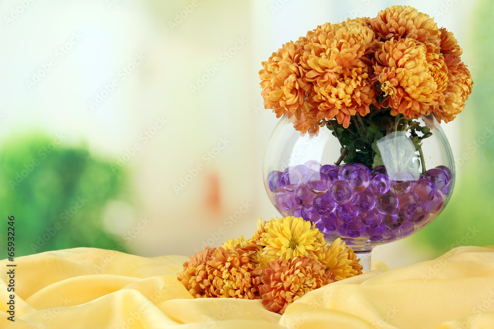Beautiful flowers in vase with hydrogel