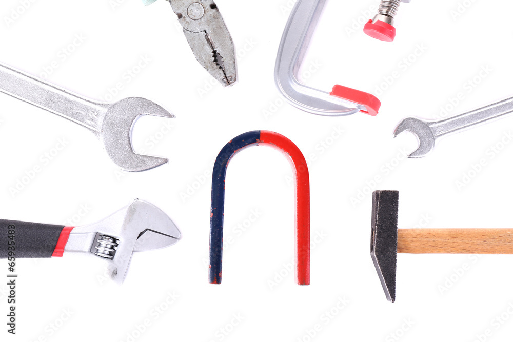 Composition of magnet and tools isolated on white