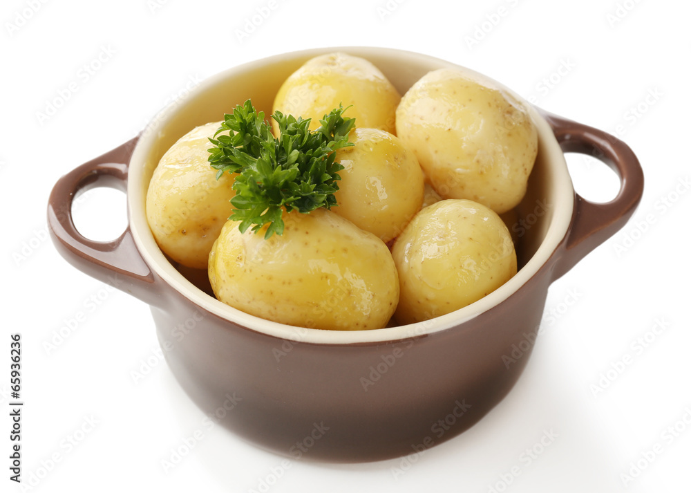 Young boiled potatoes in bowl, isolated on white