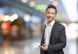 © asierromero - portrait of young asian man showing a visit card