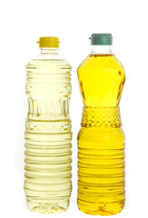 Soybean oil and palm oil in plastic bottle isolated on white