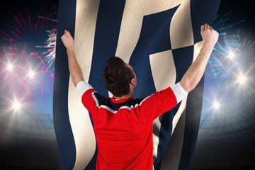 Wall Mural - Composite image of excited football fan cheering