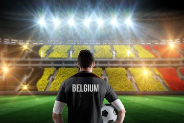 Wall Mural - Composite image of belgium football player holding ball