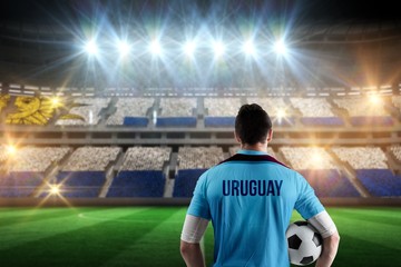 Poster - Composite image of uruguay football player holding ball