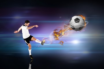 Poster - Composite image of football player in white kicking