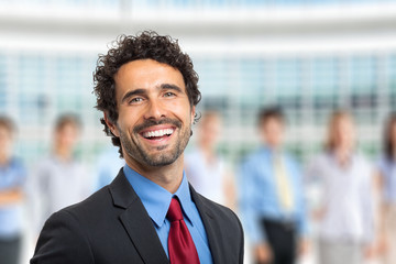 Sticker - Leader in front of a group of business people