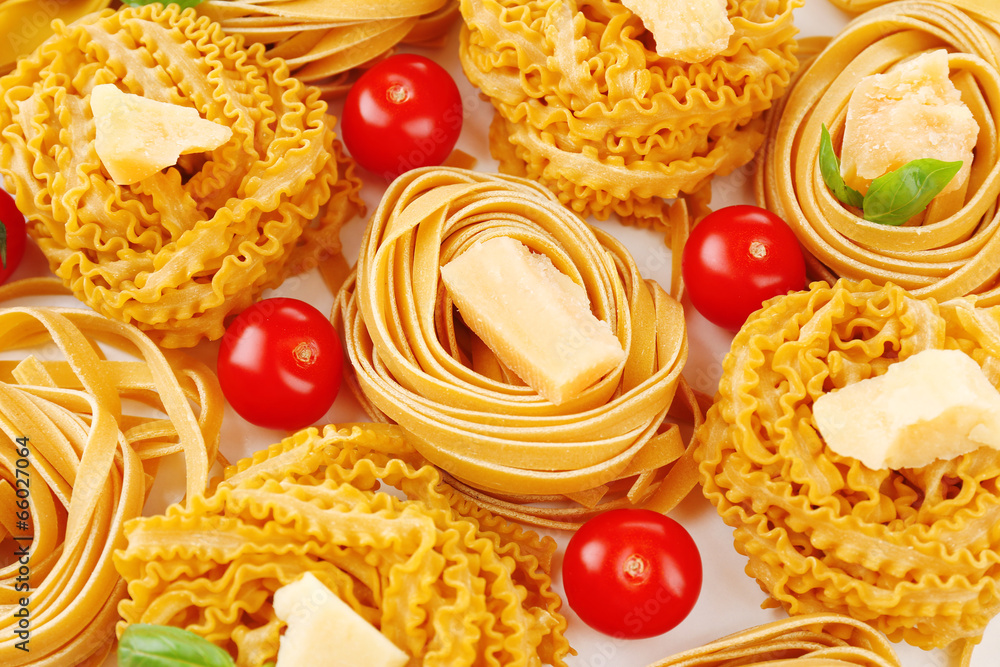 Raw homemade pasta and tomatoes, closeup