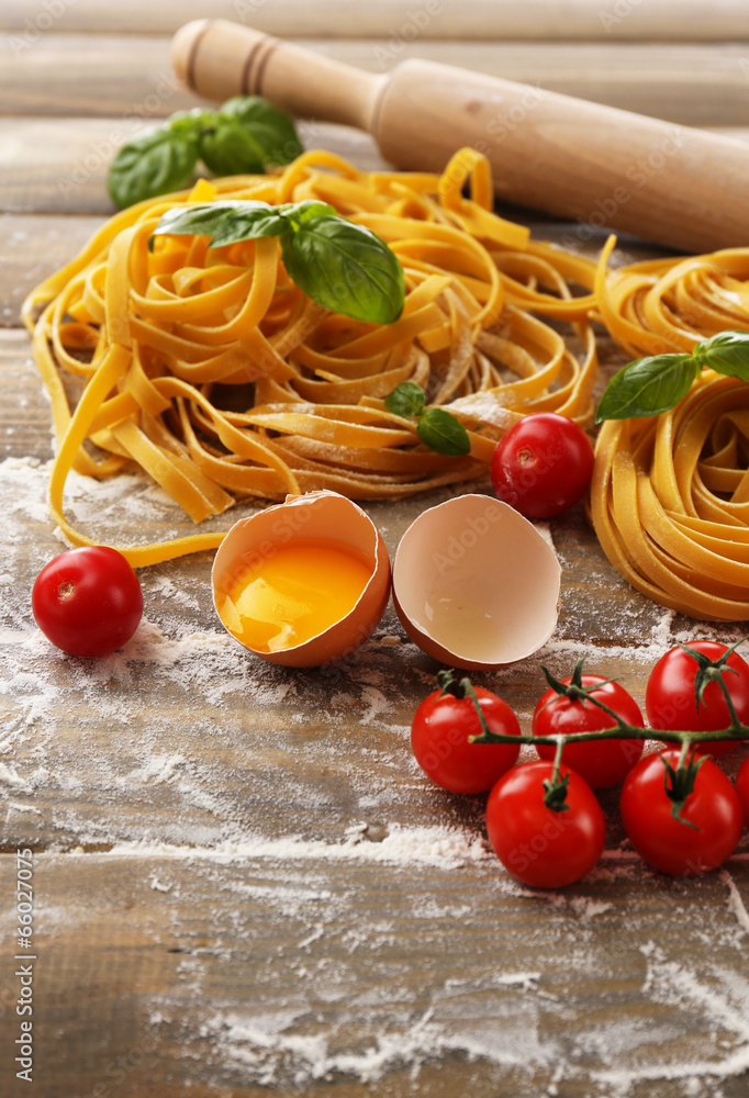 Still life with raw homemade pasta and ingredients for pasta