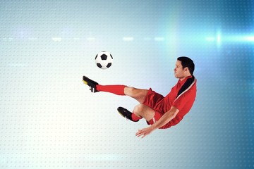 Poster - Composite image of football player in red kicking