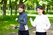 © taka - young asian women jogging in the park