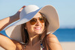 © godfer - woman on vacation with  sun hat and glasses.