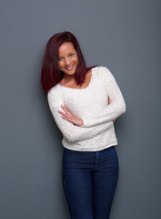 Wall Mural - Woman smiling with arms crossed