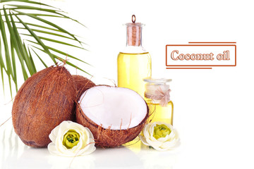 Wall Mural - Coconuts and coconut oil, isolated on white