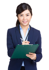 Wall Mural - Businesswoman write on clipboard