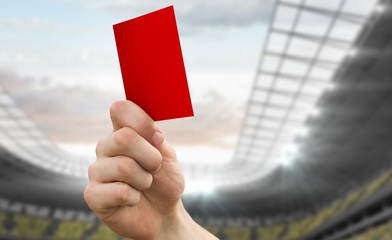 Poster - Composite image of hand holding up red card