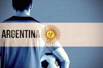 Poster - Composite image of argentina football player holding ball