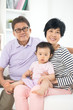 © wong yu liang - chinese grandparents with granddaugther with life style backgrou