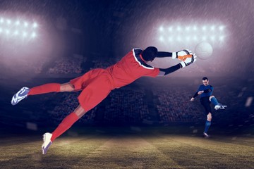 Aufkleber - Composite image of goalkeeper in red making a save