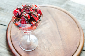 Canvas Print - Fresh strawberries under chocolate topping in the glass