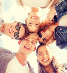Wall Mural - group of teenagers looking down