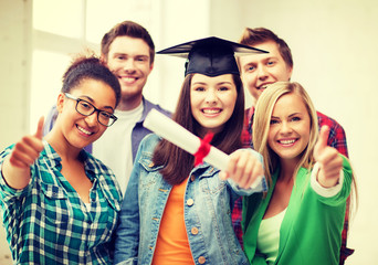 Canvas Print - girl in graduation cap with certificate