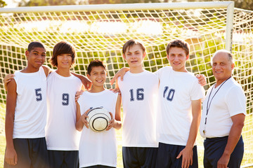 Wall Mural - Members Of Male High School Soccer Team With Coach