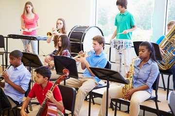 Wall Mural - pupils playing musical instruments in school orchestra