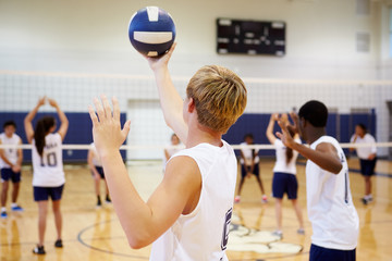 Wall Mural - high school volleyball match in gymnasium