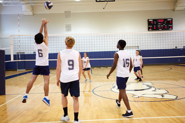 Wall Mural - high school volleyball match in gymnasium