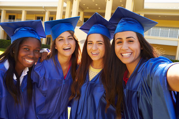 Wall Mural - Group Of Female High School Students Celebrating Graduation