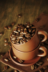 Wall Mural - Coffee beans in cup