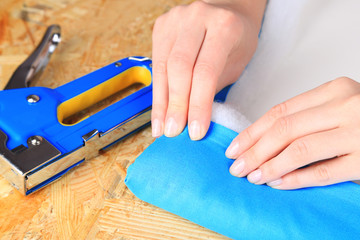 Poster - Fastening fabric and board using construction stapler