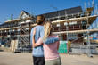 Young couple on construction site