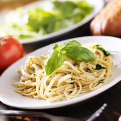 Wall Mural - plate of italian spaghetti with pesto sauce