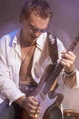 Male Guitarist Playing the Electric Guitar.