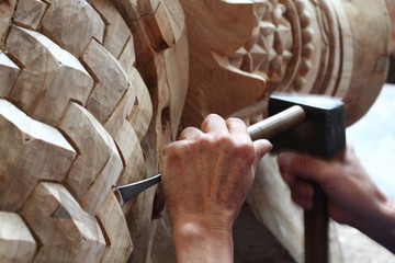 Craftsman carving wood