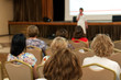 © elen31 - people sitting rear at the business conference and speaker